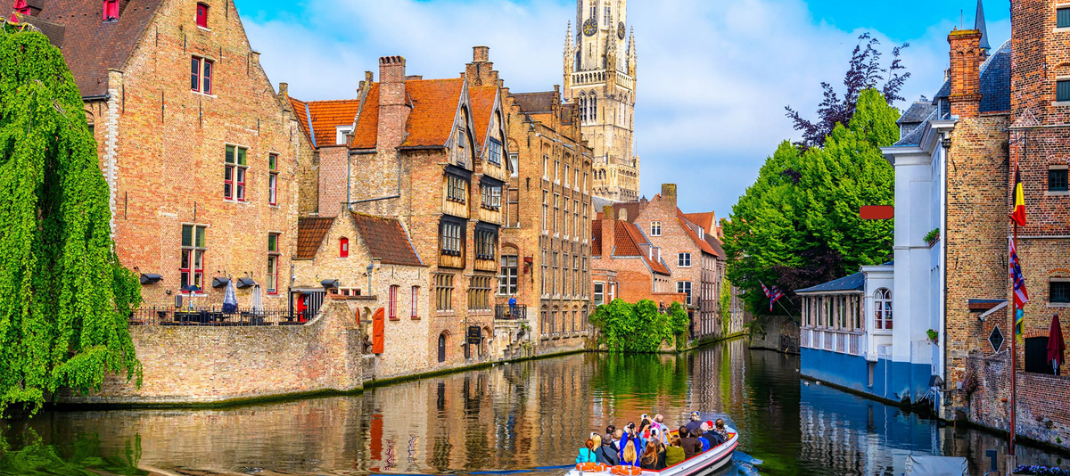 Classic view of the historic city center with canal in Brugge, West Flanders province, Belgium. Cityscape of Bruges.