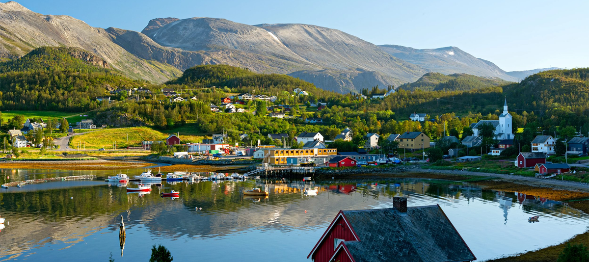 Characteristic small norwegian town near a fiord. Near Alta, Norway.
