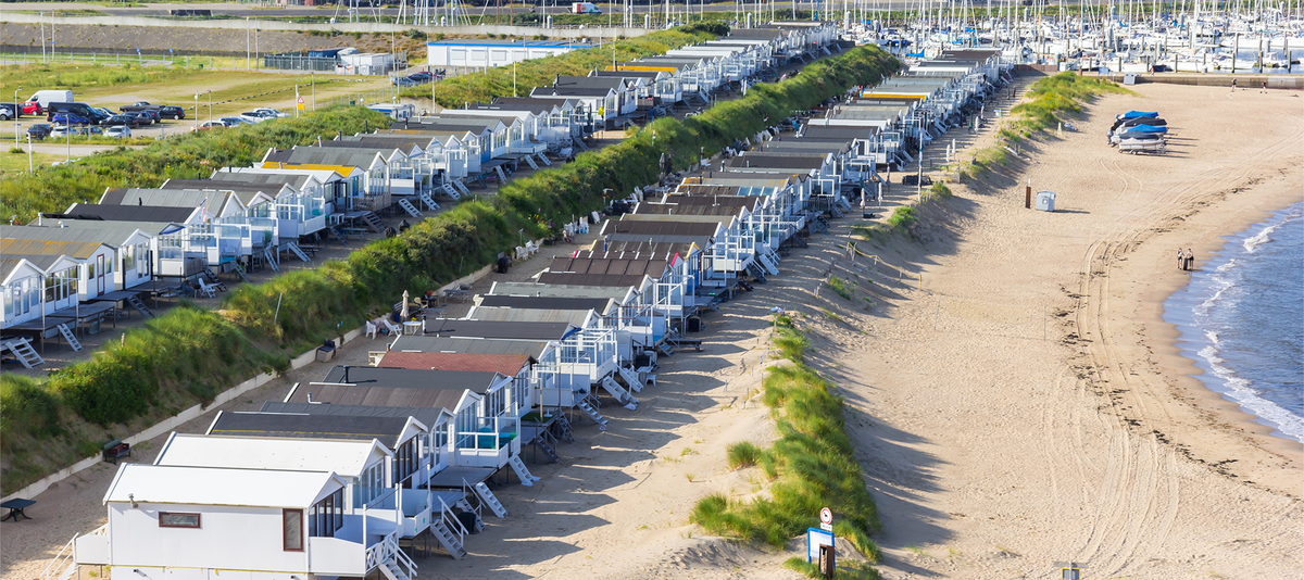 Wooden cabins in the dunes of the North Sea coast of IJmuiden, Netherlands