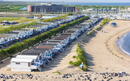 Wooden cabins in the dunes of the North Sea coast of IJmuiden, Netherlands