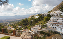 The spanish white washed village of Mijas pueblo with Sierra de Mijas behind, Andalusia, Malaga province, Spain