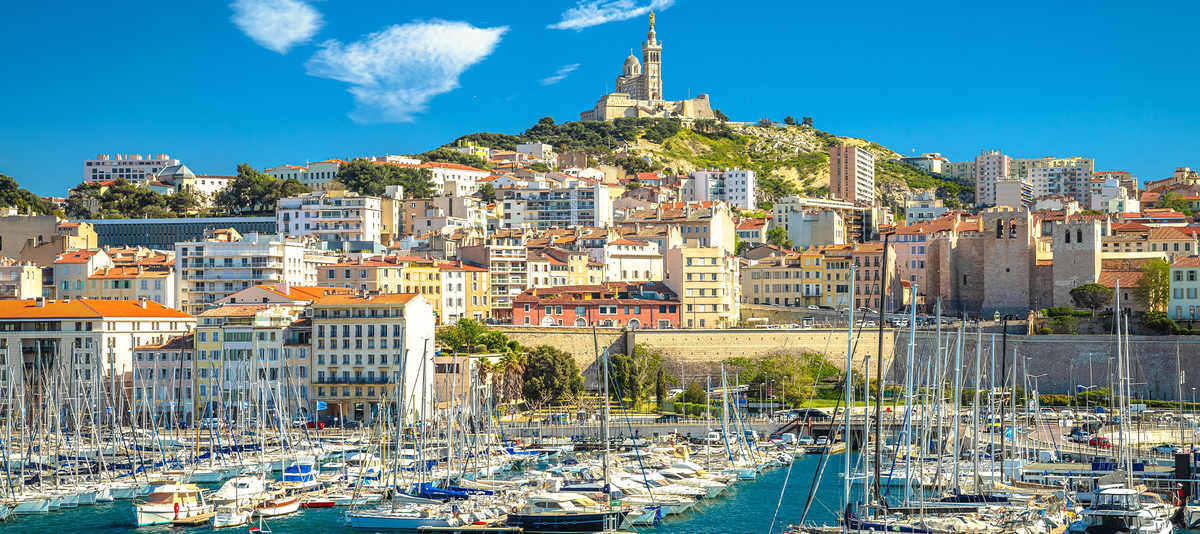 City of Marseille harbor and Notre Dame de la Garde church on the hill view, southern France