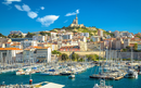 City of Marseille harbor and Notre Dame de la Garde church on the hill view, southern France