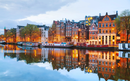 Night city view of Amsterdam, the Netherlands with Amstel river
