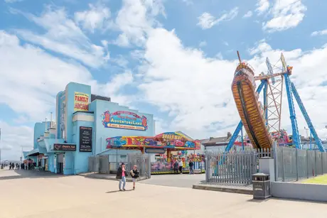 Art deco New Palace building next to the outdoor funfair