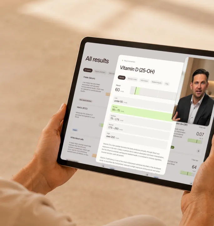 Tablet showing blood results next to a video call with a doctor
