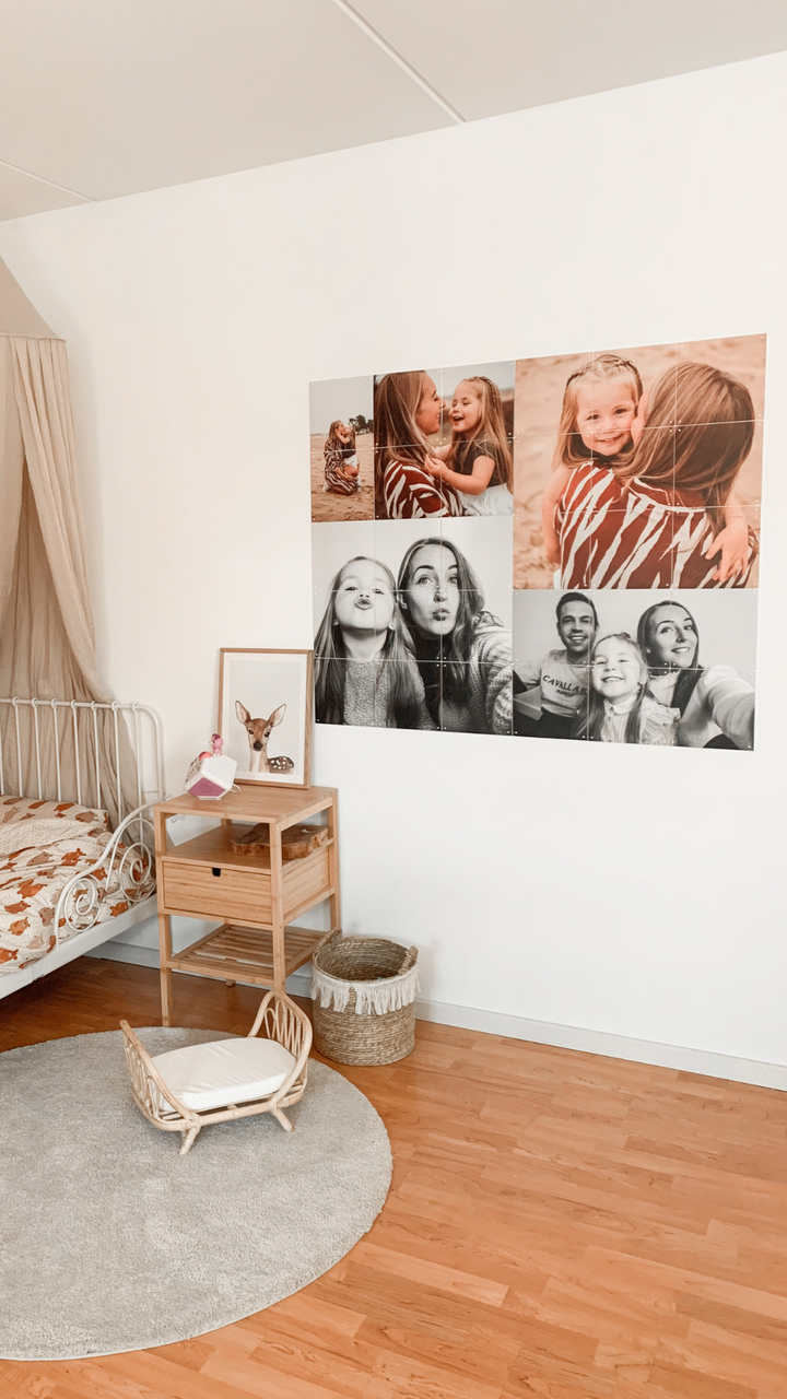 Photo collage IXXI of family pictures on a child’s bedroom wall, beside a bed with a canopy