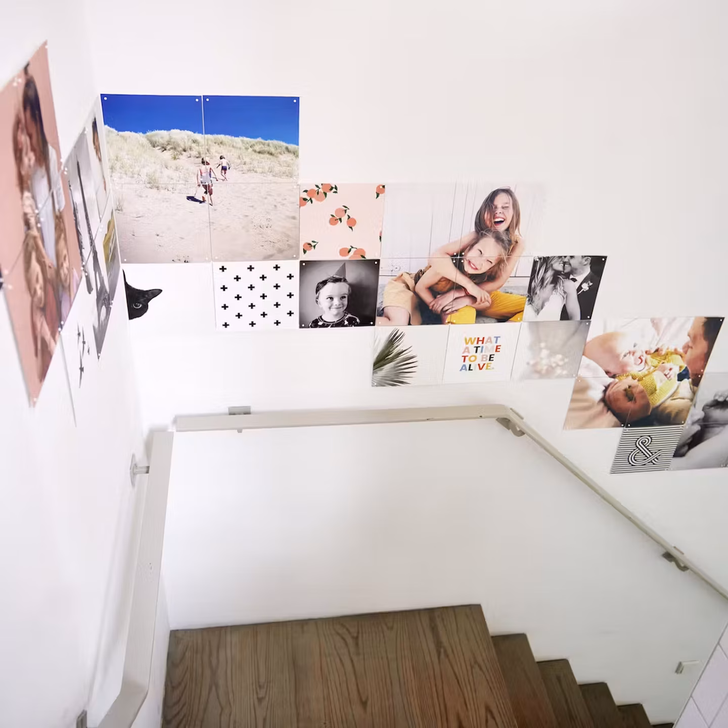 Photo IXXI hung in a cascade down a stairwell wall, following the line of the steps