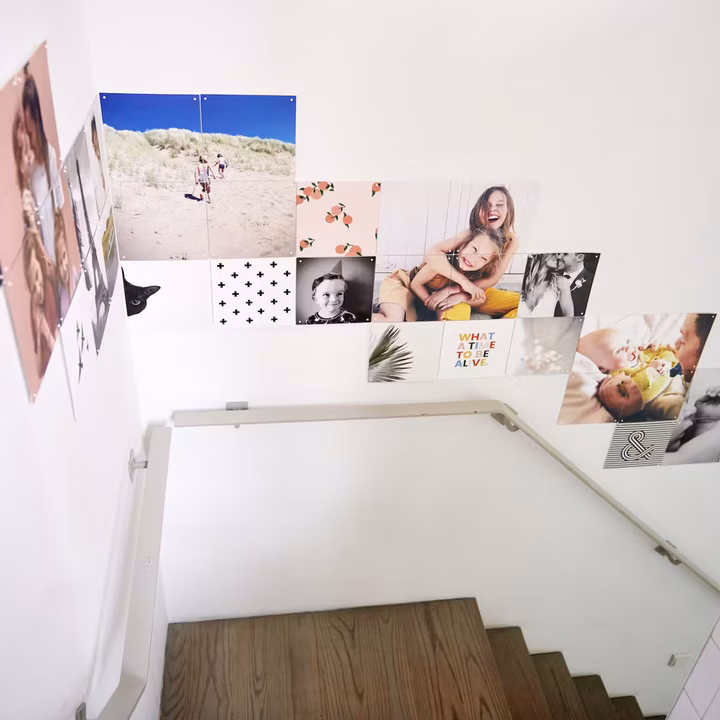 Photo IXXI hung in a cascade down a stairwell wall, following the line of the steps