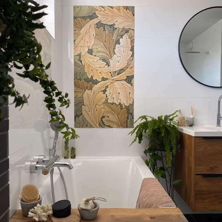 Botanical IXXI of leaves on the wall beside a bath, facing a round mirror