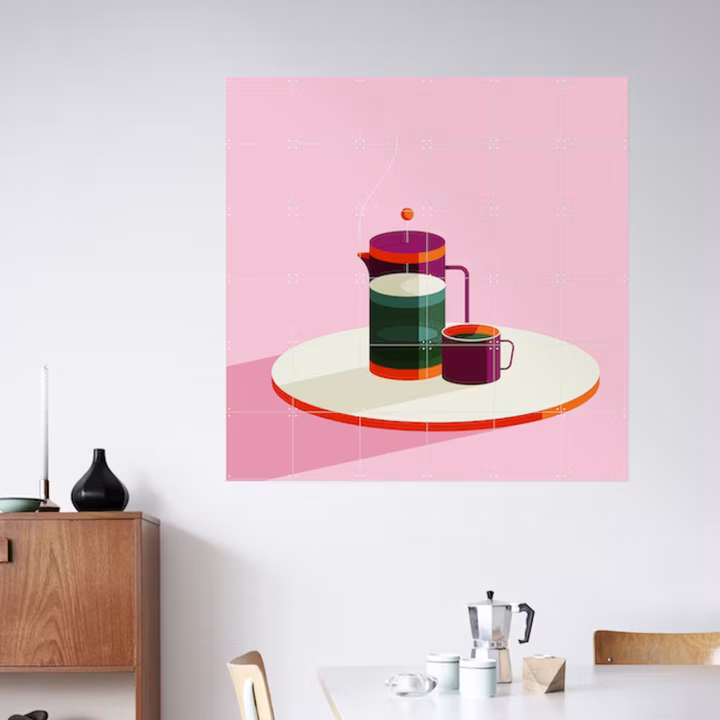 IXXI of an illustrated cafetière on a white wall, above a table with a moka pot and cups