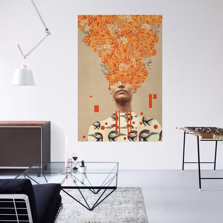 Large collage IXXI of a portrait with orange flowers in a bright interior with a glass table and a foosball table