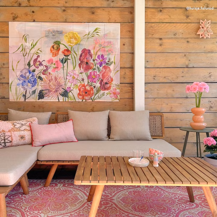 Floral IXXI on a wooden wall under a canopy, above a lounge sofa on a terrace