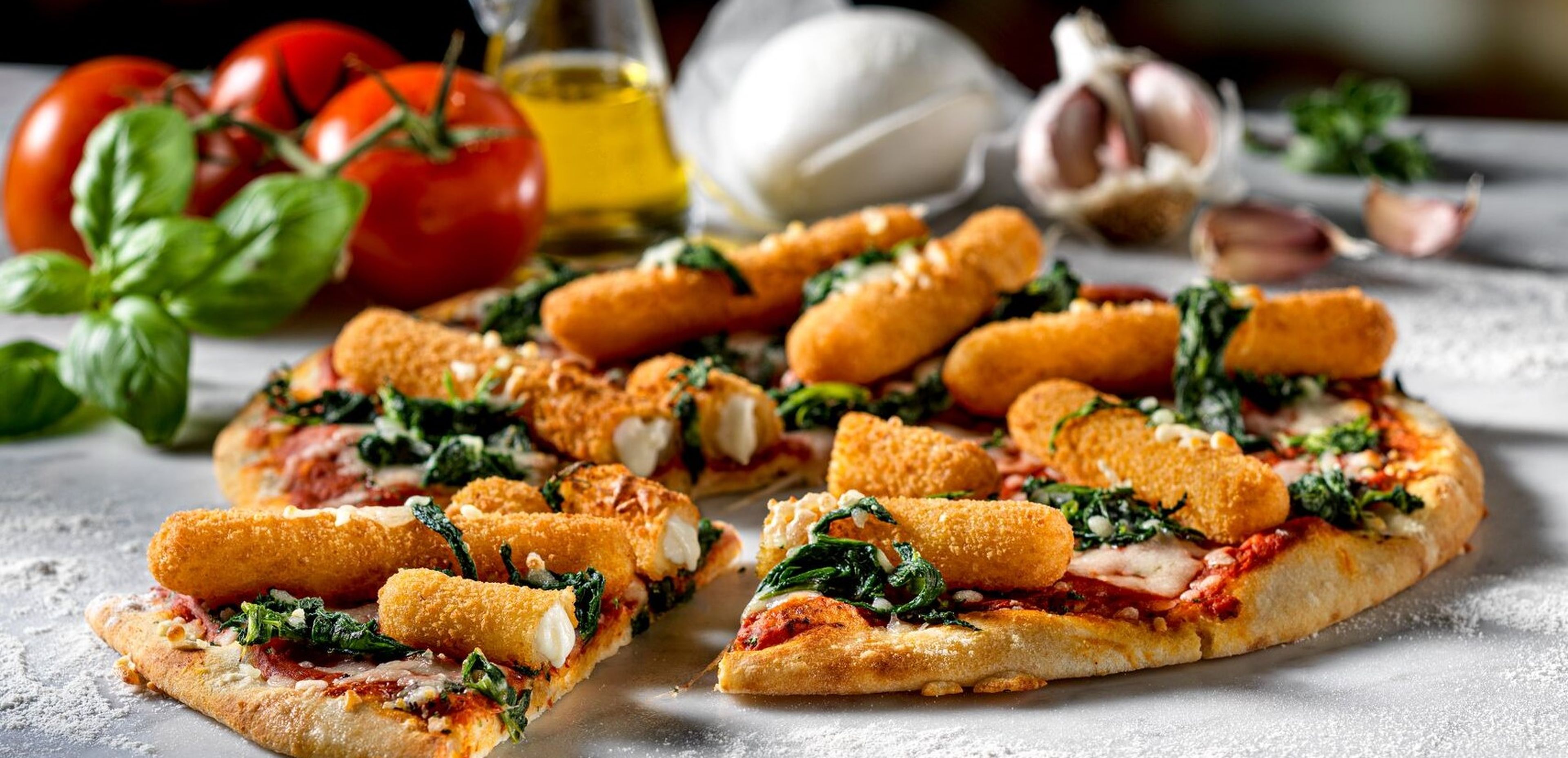 Pizza topped with Mozzarella Sticks close-up