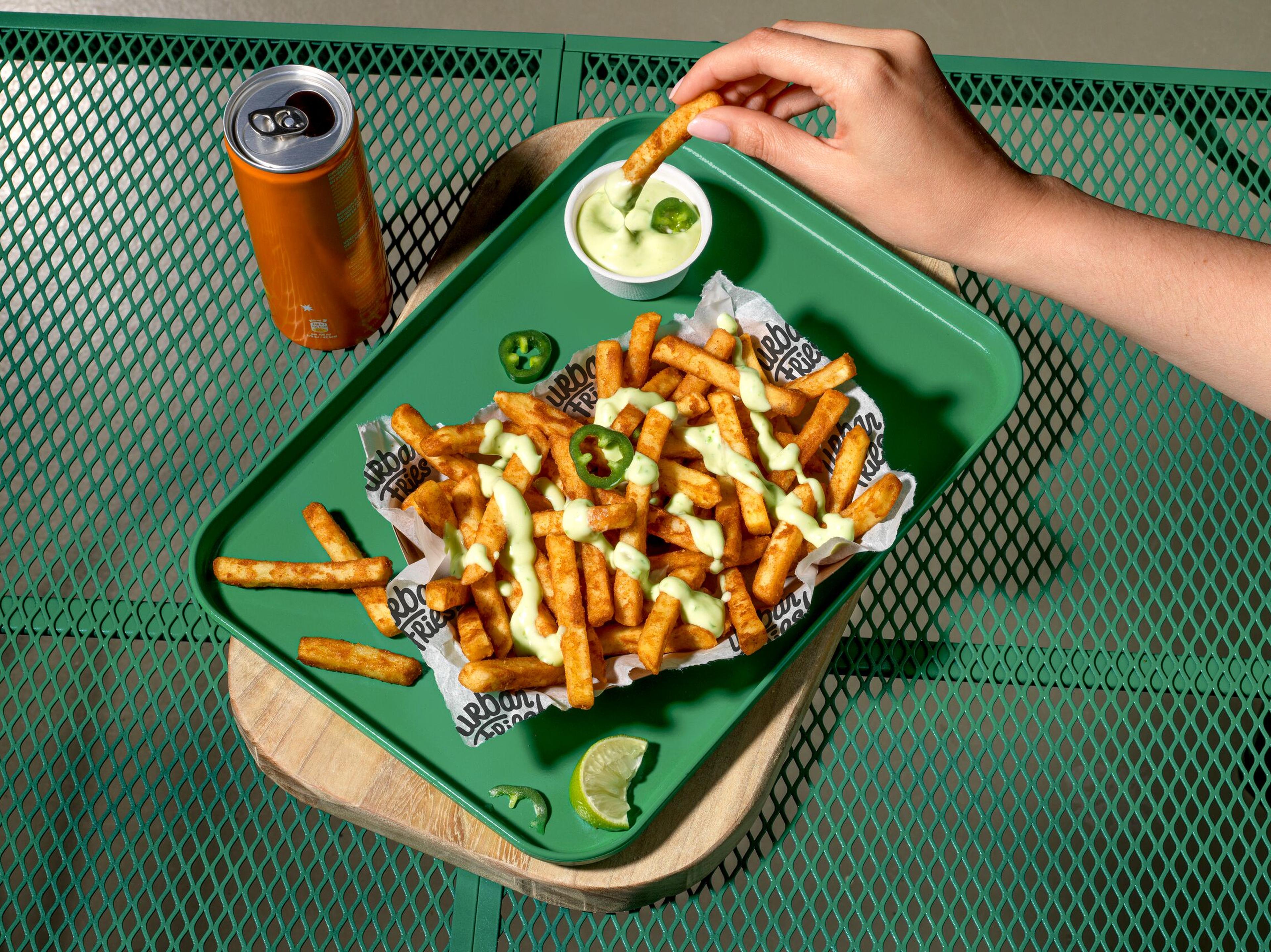 Urban Fries 10 mm Sauce Sweet and sour Jalapeño dressing hand landscape