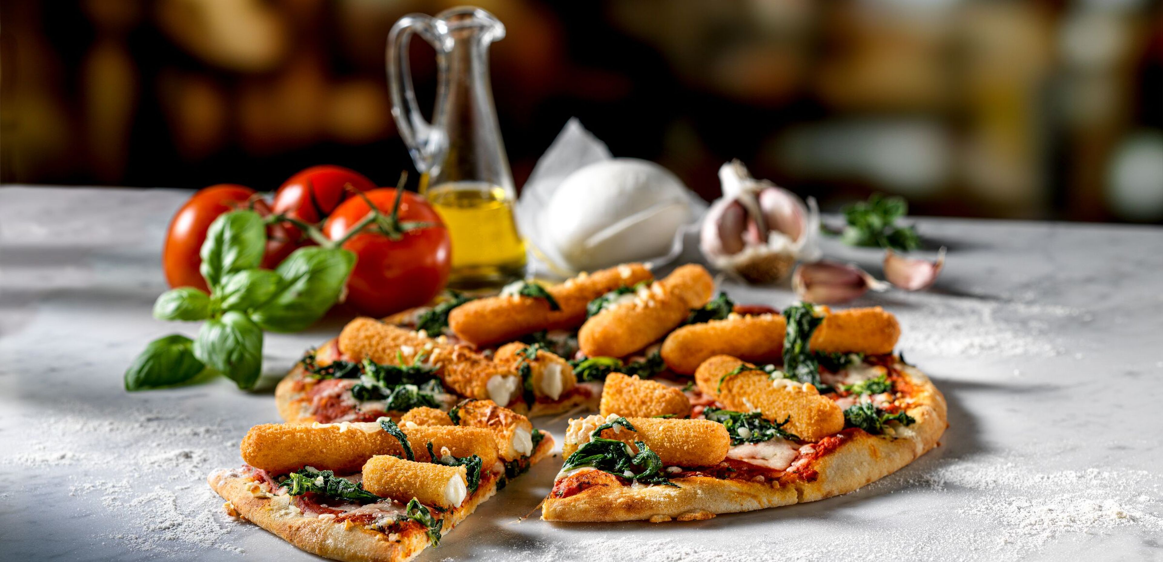 Pizza topped with Mozzarella Sticks