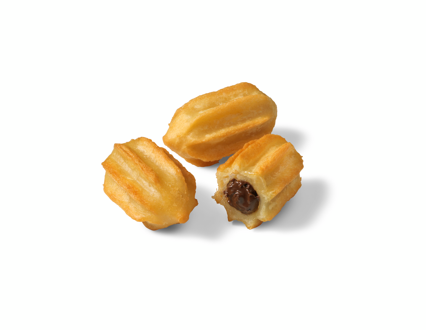 Three golden fried baby churros, one broken open revealing a chocolate filling inside, on a white background.