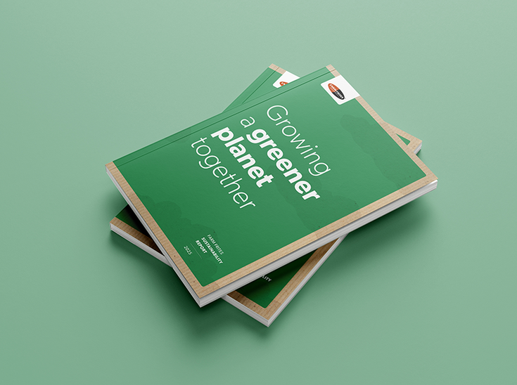 Three green booklets titled "Growing a Greener Planet Together" on a matching green background.