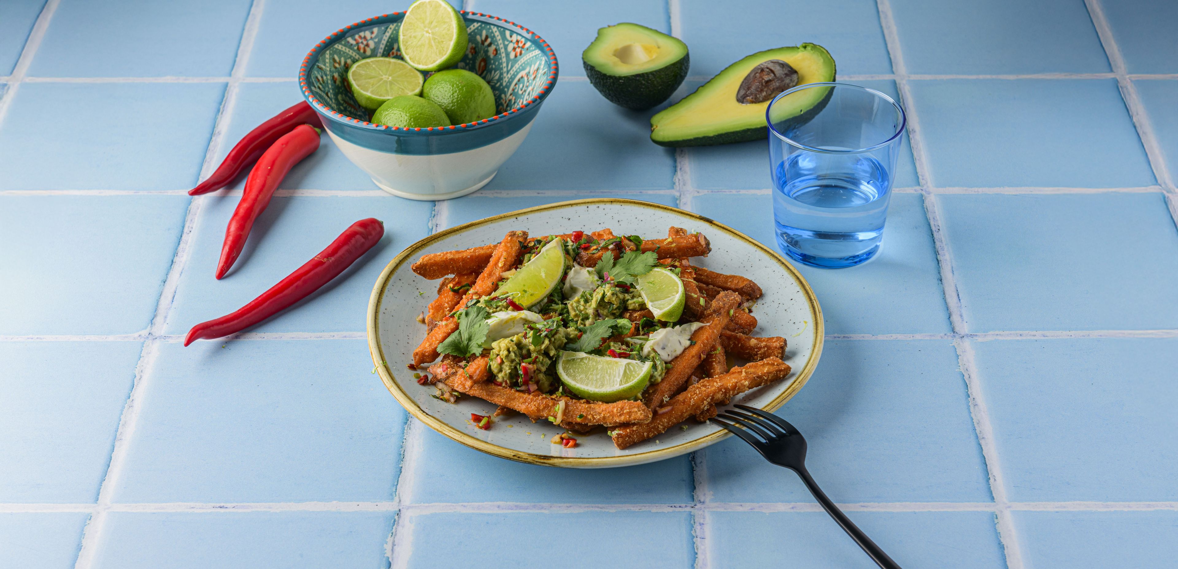 Loaded Fries with Sweet Potato Fries, Chili Salsa, Guacamole and Crème Fraîche