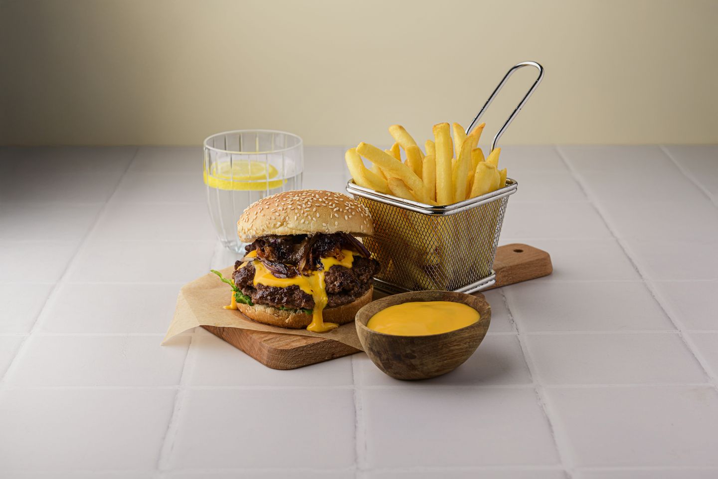 smashburger-with-Caramelized-Onions-Cheddar-Cheese-Sauce-and-Crispy-Fries