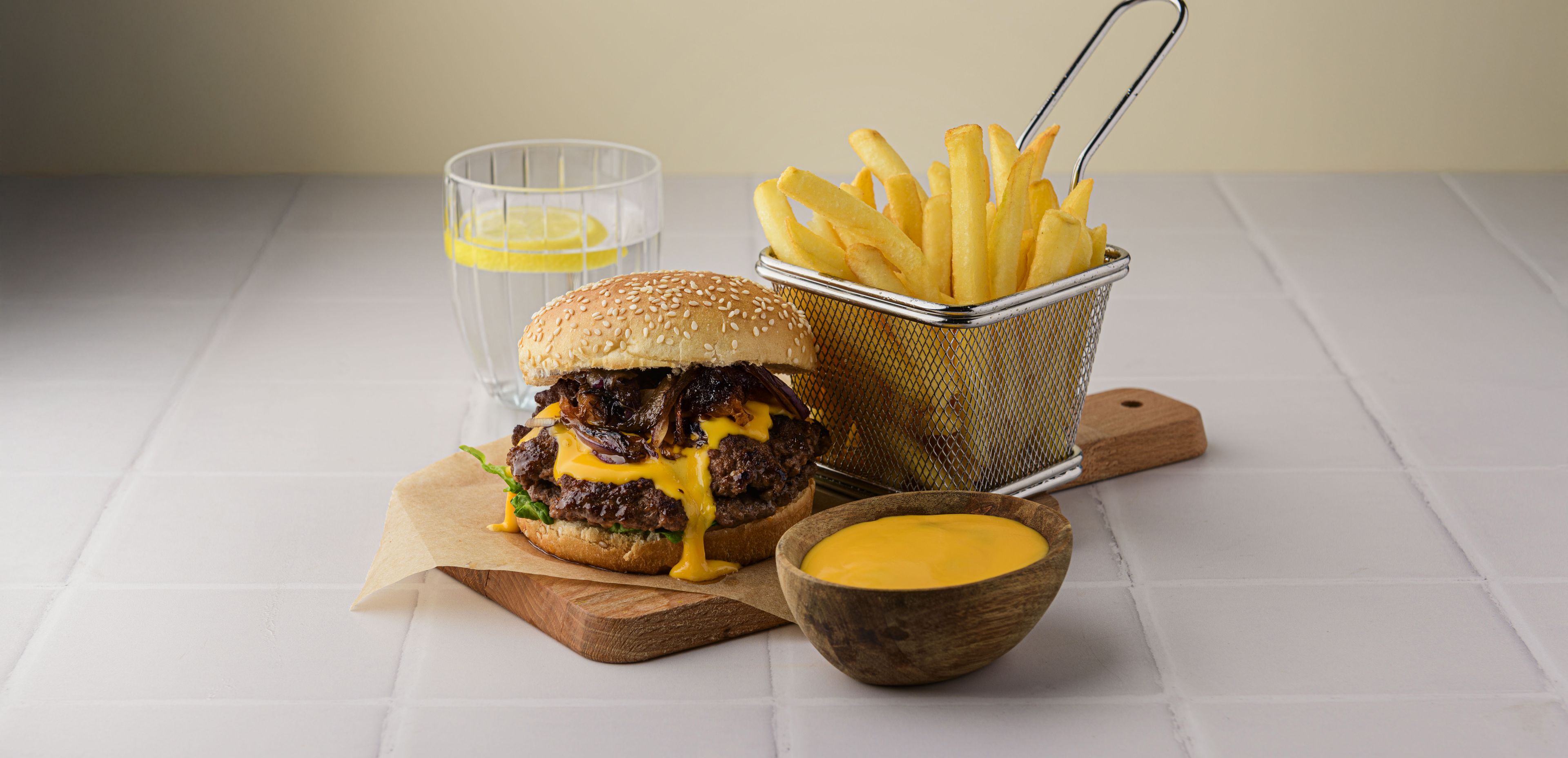smashburger-with-Caramelized-Onions-Cheddar-Cheese-Sauce-and-Crispy-Fries