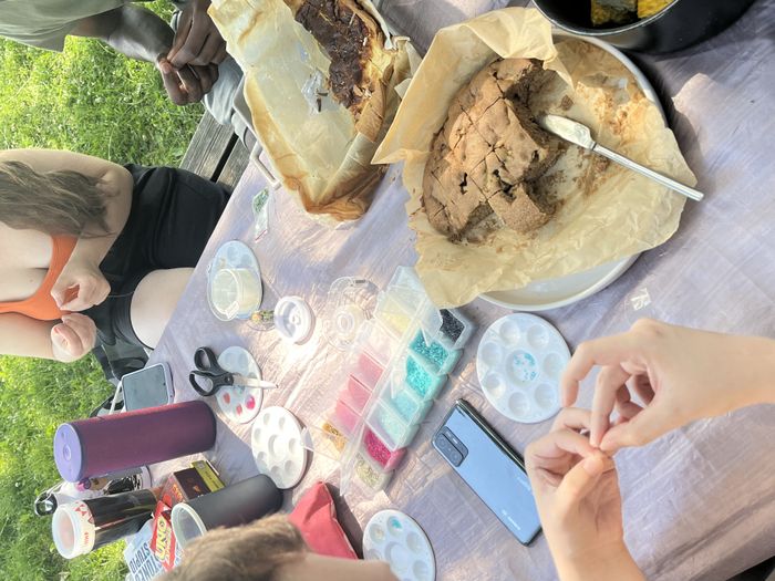 Creating bracelets while eating a homemade pie!