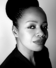 black and white photo of woman looking at the camera