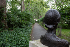 a bronze bust of Virginia Woolf overlooks the gardens of Tavistock Square