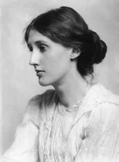 black and white archive photograph of young white woman wearing a white muslin dress, with her brown hair pulled back in a bun.