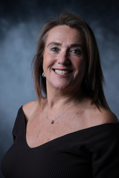 photo of woman smiling at camera