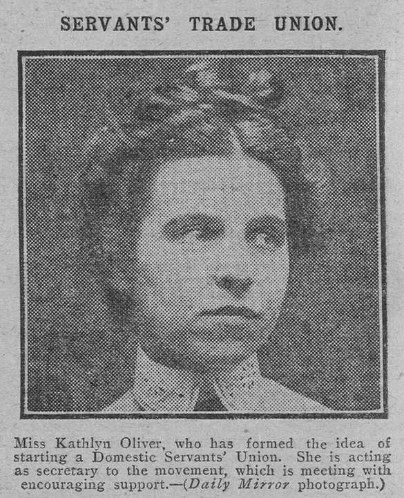 Black and white newspaper clipping with image of a woman with her hair tied in a bun.