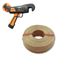 Orange hand-held strapping tool above a coiled roll of brown strapping tape on a white background.