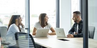 Two people working in office