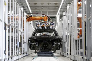 car in the production area with kuka robot