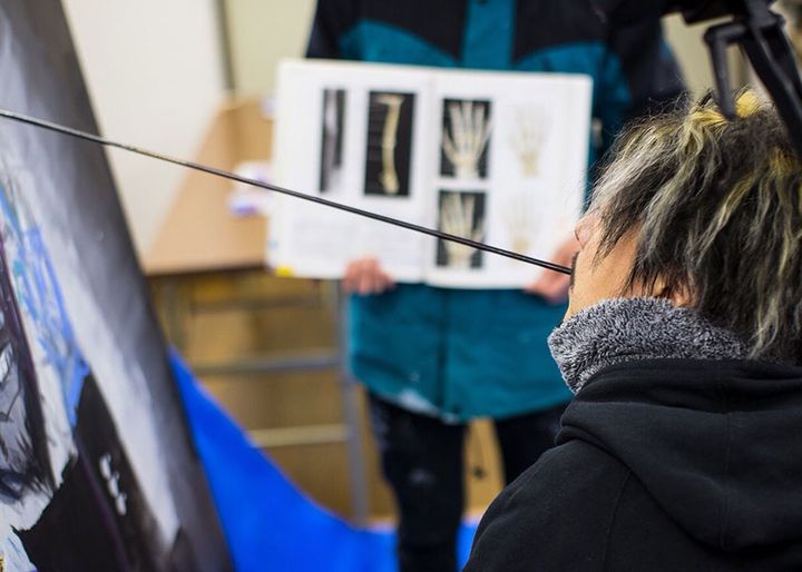 Takayuki Matsumine drawing art with a brush