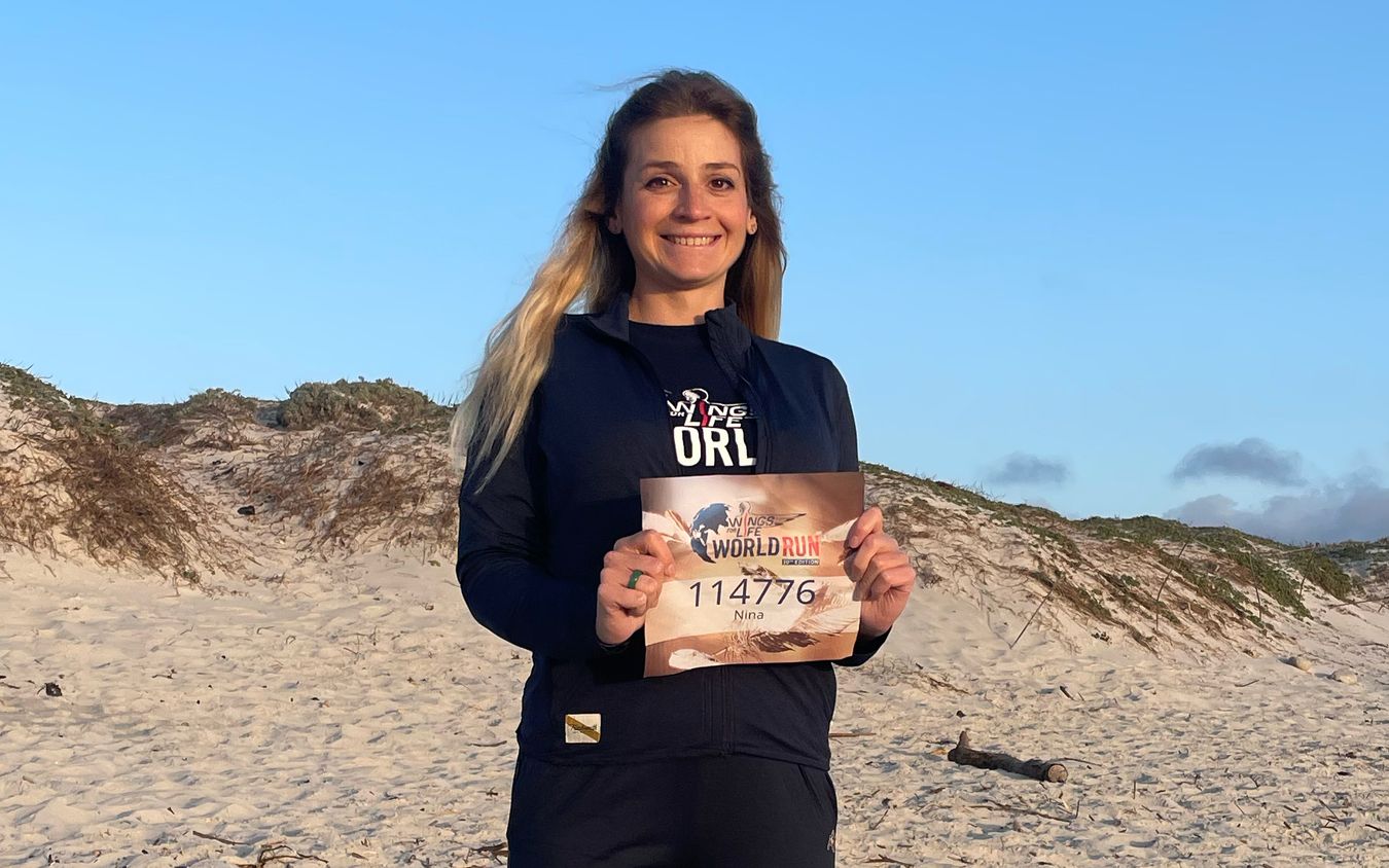 Nina Zarina Usubyan holding her start number for the 10th edition of the Wings for Life World Run