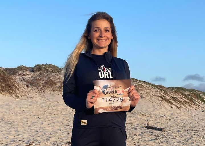 Nina Zarina Usubyan holding her start number for the 10th edition of the Wings for Life World Run