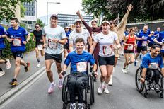 (L-R) Simon Ehammer, Marco Odermatt and Daniela Ryf with wheelchair athlete Joel Jung seen during the Wings for Life World Run in Zug, Switzerland on May 04, 2025.