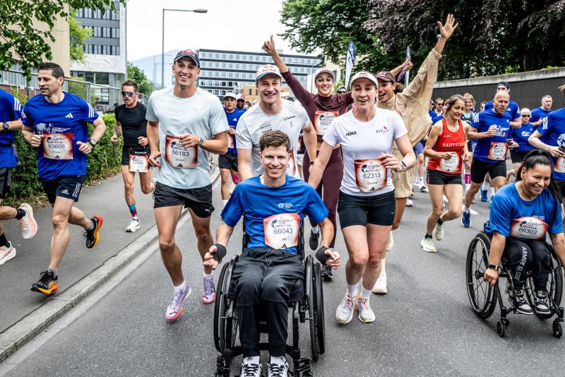 (L-R) Simon Ehammer, Marco Odermatt and Daniela Ryf with wheelchair athlete Joel Jung seen during the Wings for Life World Run in Zug, Switzerland on May 04, 2025.