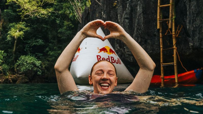 Molly Carlson of Canada reacts after diving from the 22 metre platform in the Big Lagoon during the final competition day of the first stop of the Red Bull Cliff Diving World Series in El Nido, Philippines on April 13, 2025.