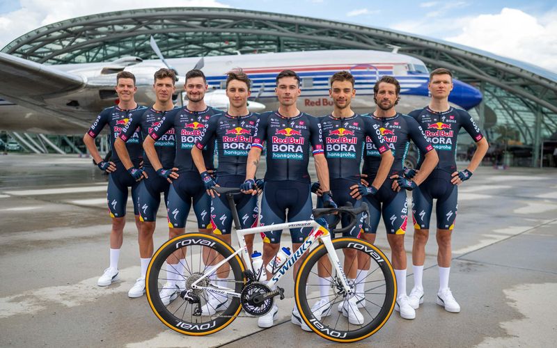 The Red Bull - BORA - hansgrohe cycling team (Jai Hindley, Aleksandr Vlasov, Marco Haller, Nico Denz, Matteo Sobrero, Primoz Roglic, Bob Jungels and Danny Van Poppel) are seen during the reveal at Hangar 7, Salzburg, Austria on June 26, 2024.