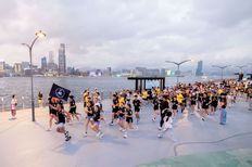Participants perform during the Wings For Life World Run 2025 in Hong Kong on May 4, 2025.