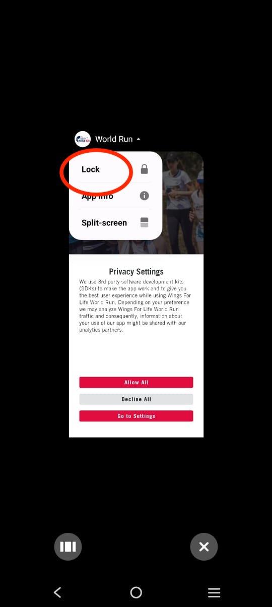 Screenshot of a mobile app menu showing options to lock the Wings for Life World Run app, view app info, and split-screen, with privacy settings and consent but