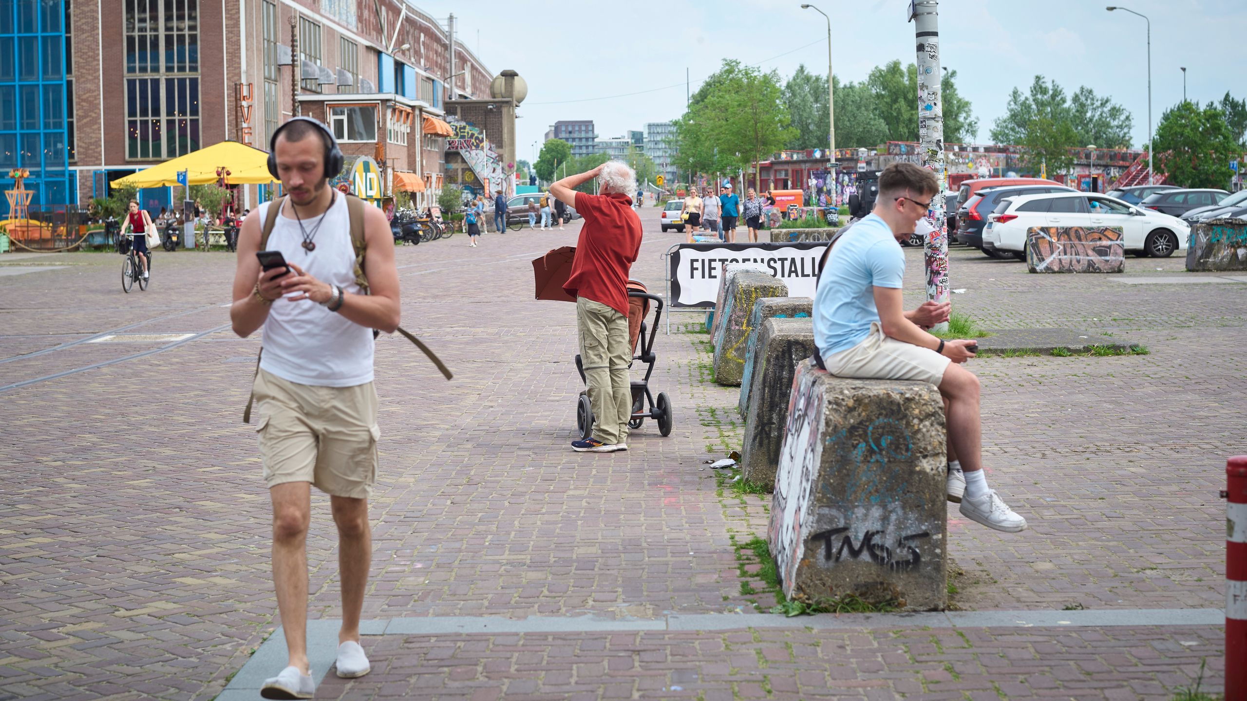 People in Amsterdam walking through the city.