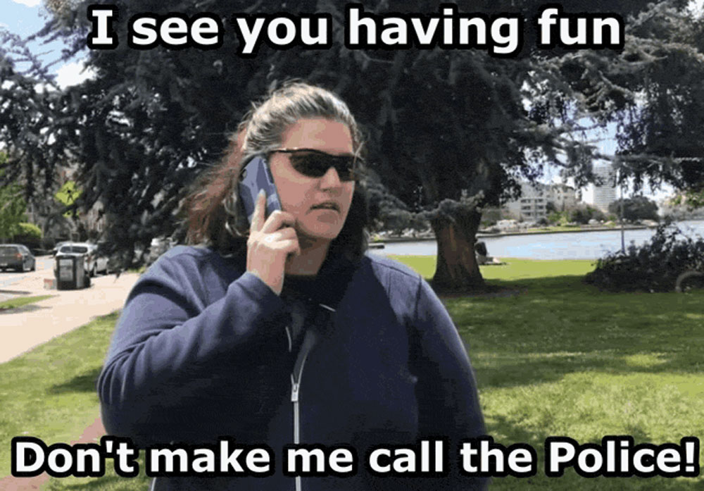 Image of a woman wearing sunglasses and looking serious and saying 'I see you having fun. Don't make me call the police.