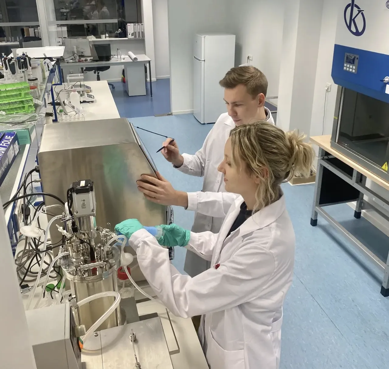 Two colleagues of maash company working in lab.