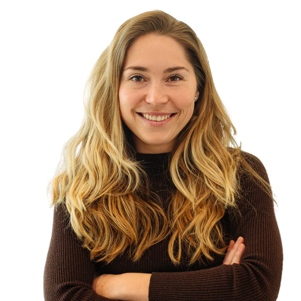 headshot of colleague Tessa, blonde woman arms crossed and smiling