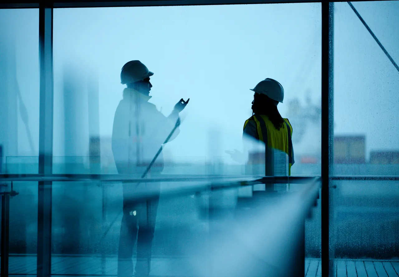 Engineers are overlooking the work site at dawn