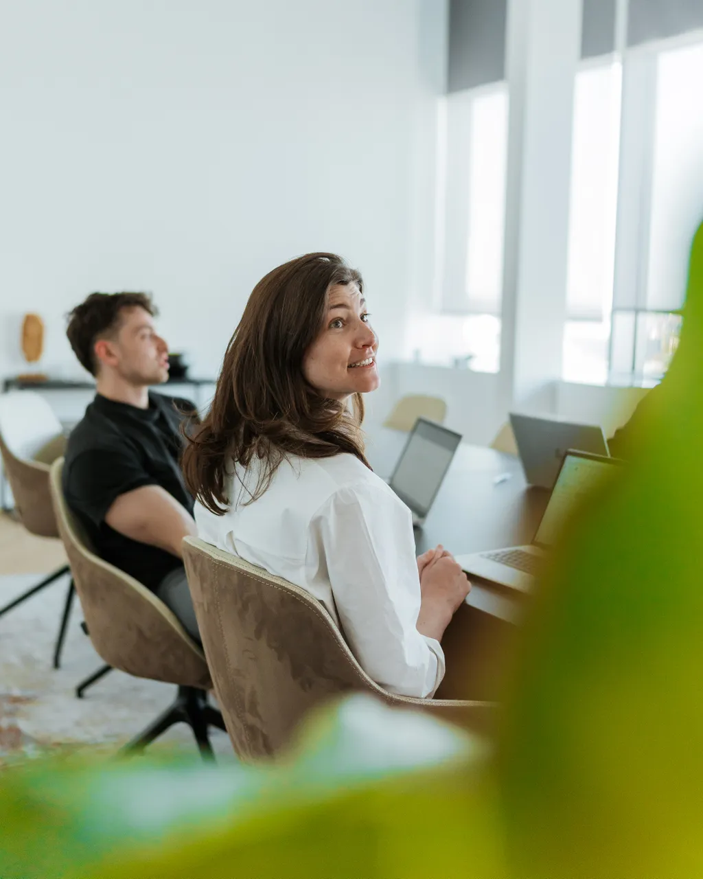 Pauwels Consulting colleagues in meeting office Ghent.