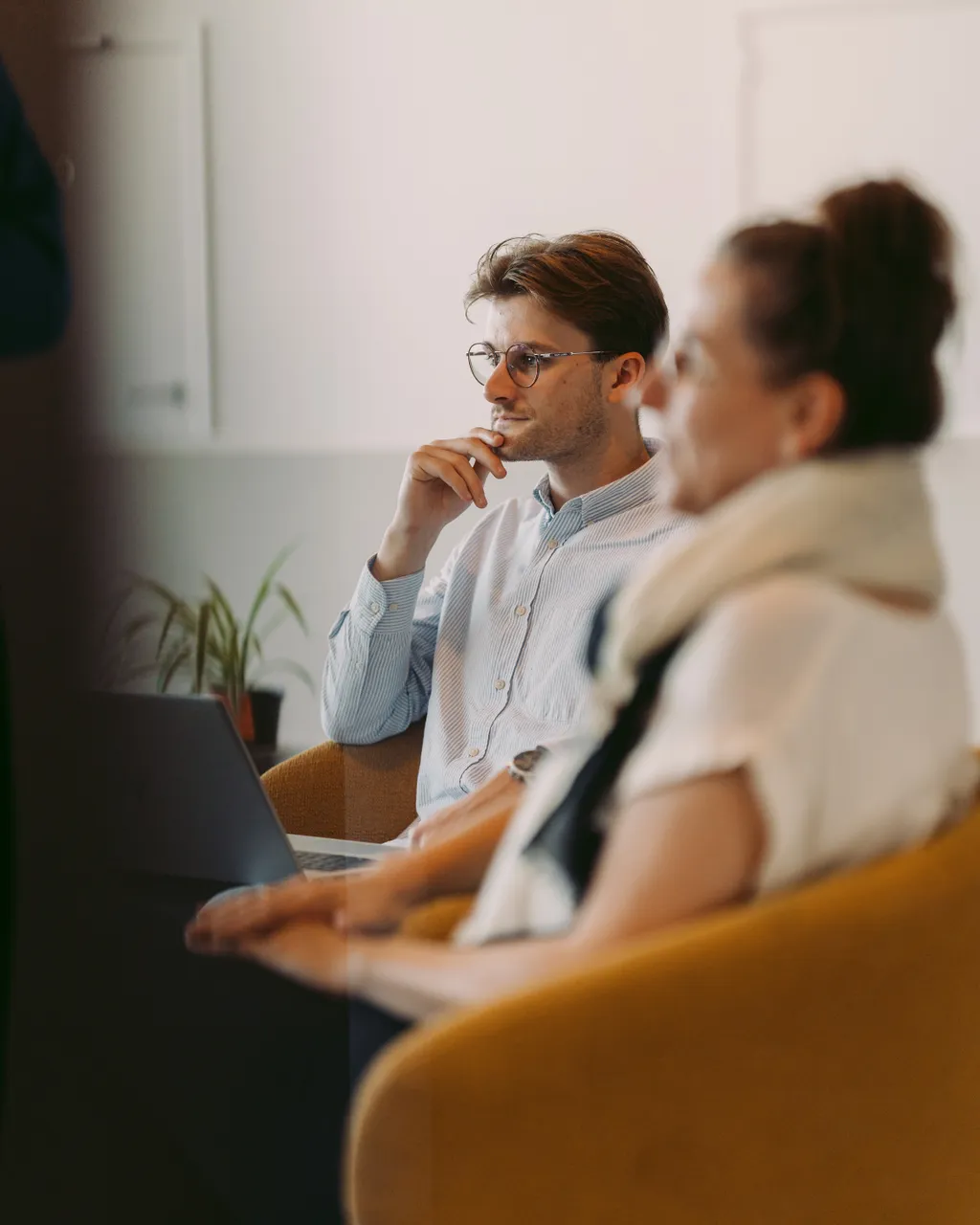 Colleagues in discussion in Ghent office, thinking and brainstorming.